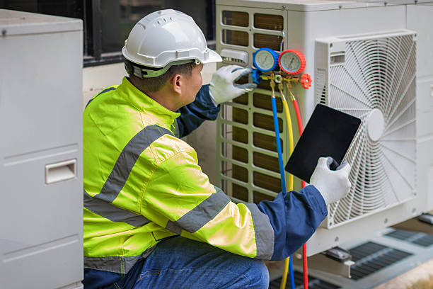 Professional Hvac technician working in Opelika, AL